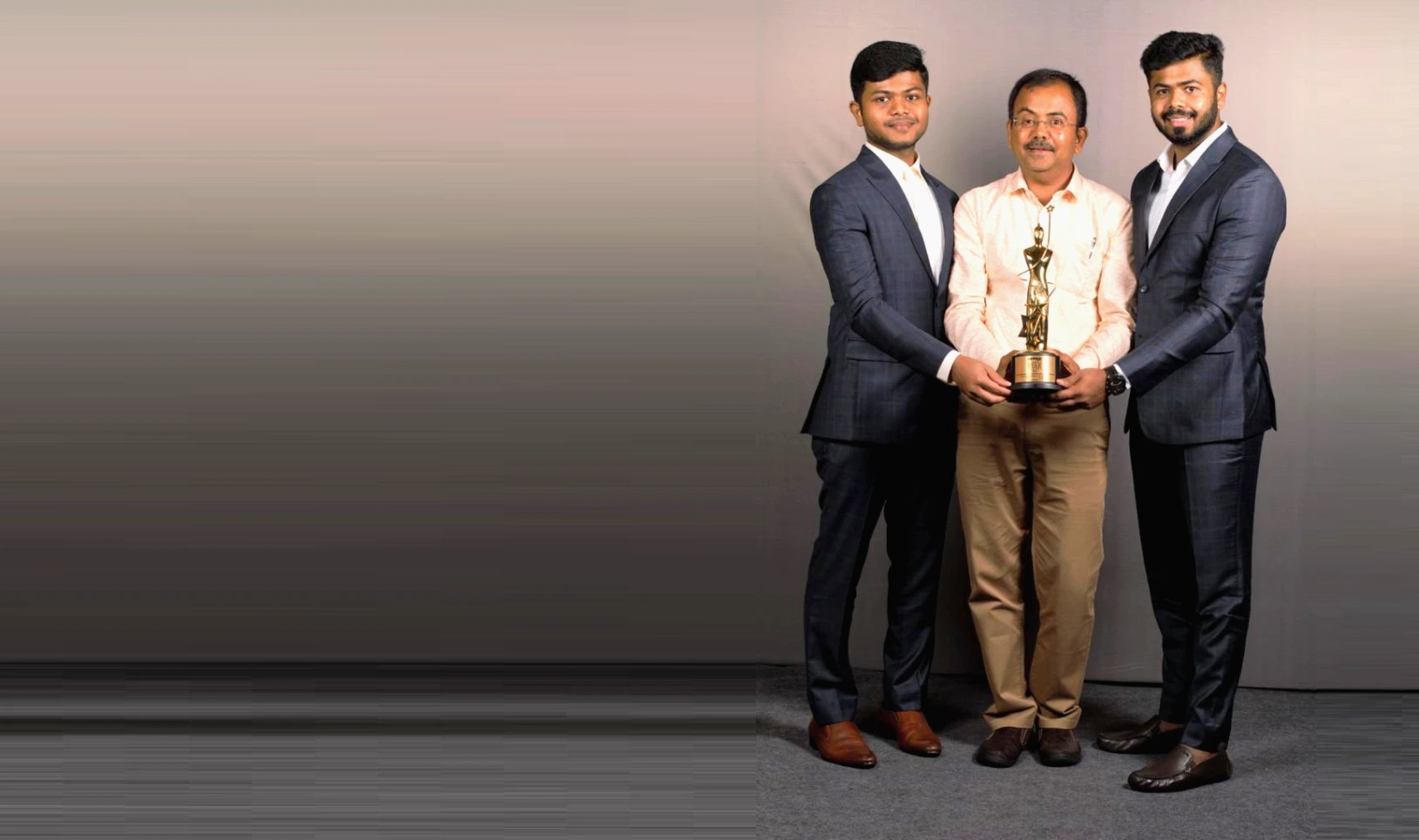 Award recognition — three leaders with the Business Star trophy