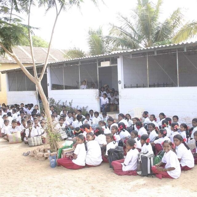 Students gathered at the supported government school in uniform